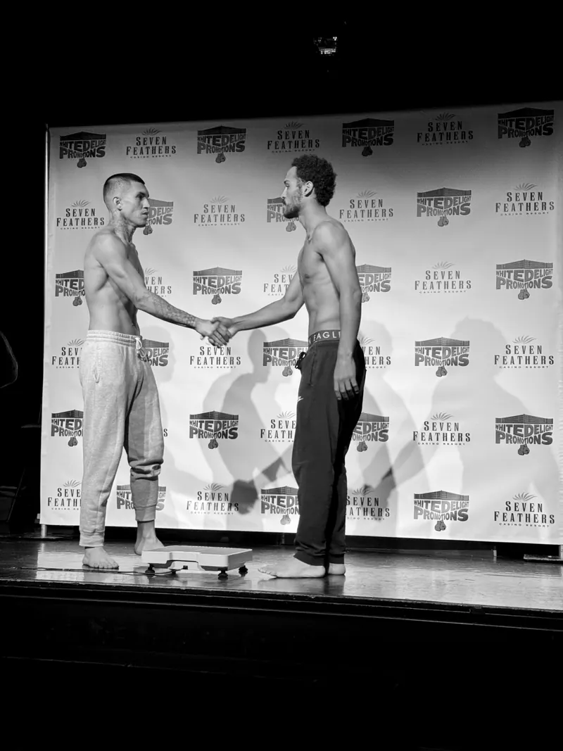 Jeremiah shaking hands with his opponent at the Seven Feathers weigh-in
