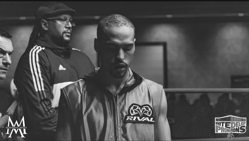 Jeremiah in a red RIVAL walkout vest before the fight