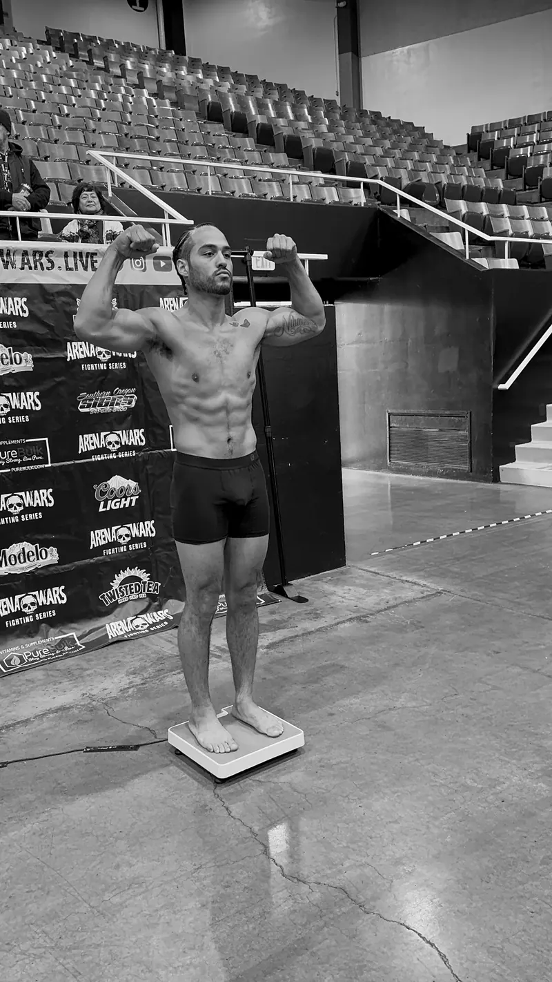 Jeremiah on the scale at the Arena Wars weigh-in