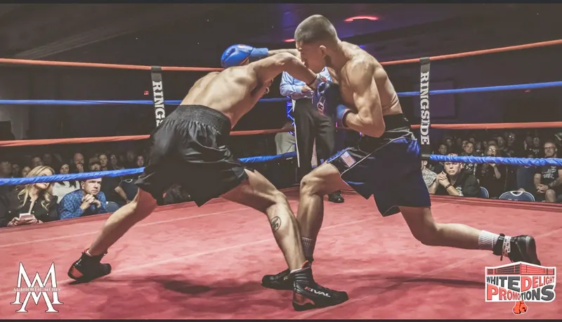 Jeremiah in black trunks trading punches at Seven Feathers