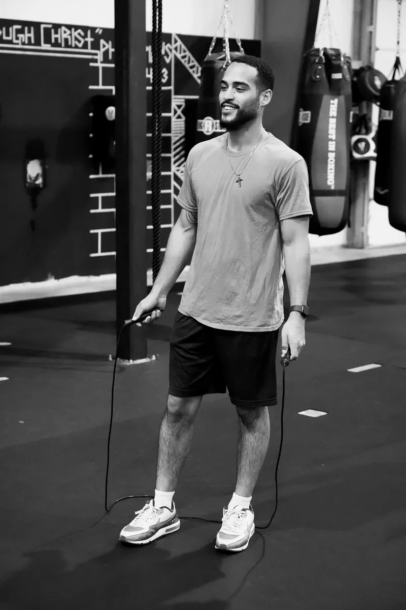 Jeremiah jumping rope and laughing between rounds