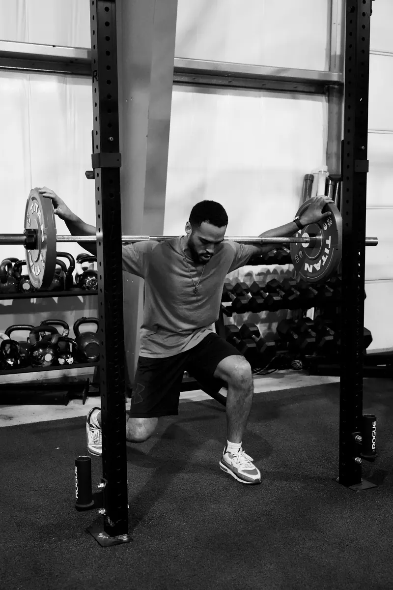 Jeremiah in a lunge with a barbell