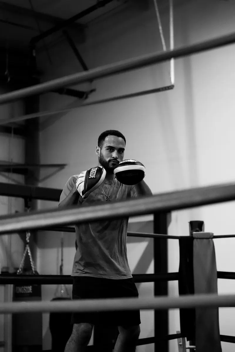 Jeremiah holding mitts in the ring